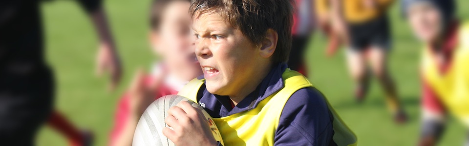 Boy playing rugby