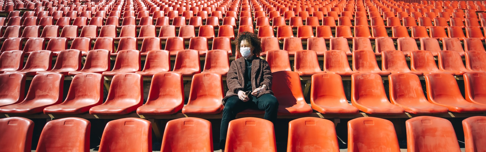 Image of women sitting in empty stand